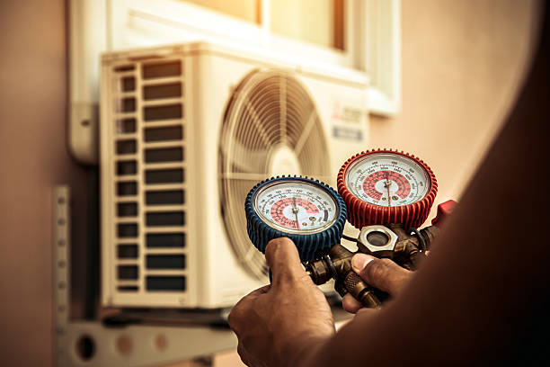 Professional Air Conditioning Service technician working in Greensboro, MD